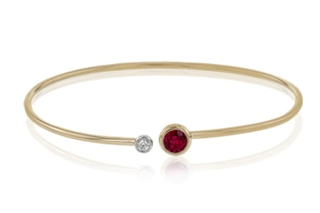a sleek ruby bangle with a diamond accent from Simon G.