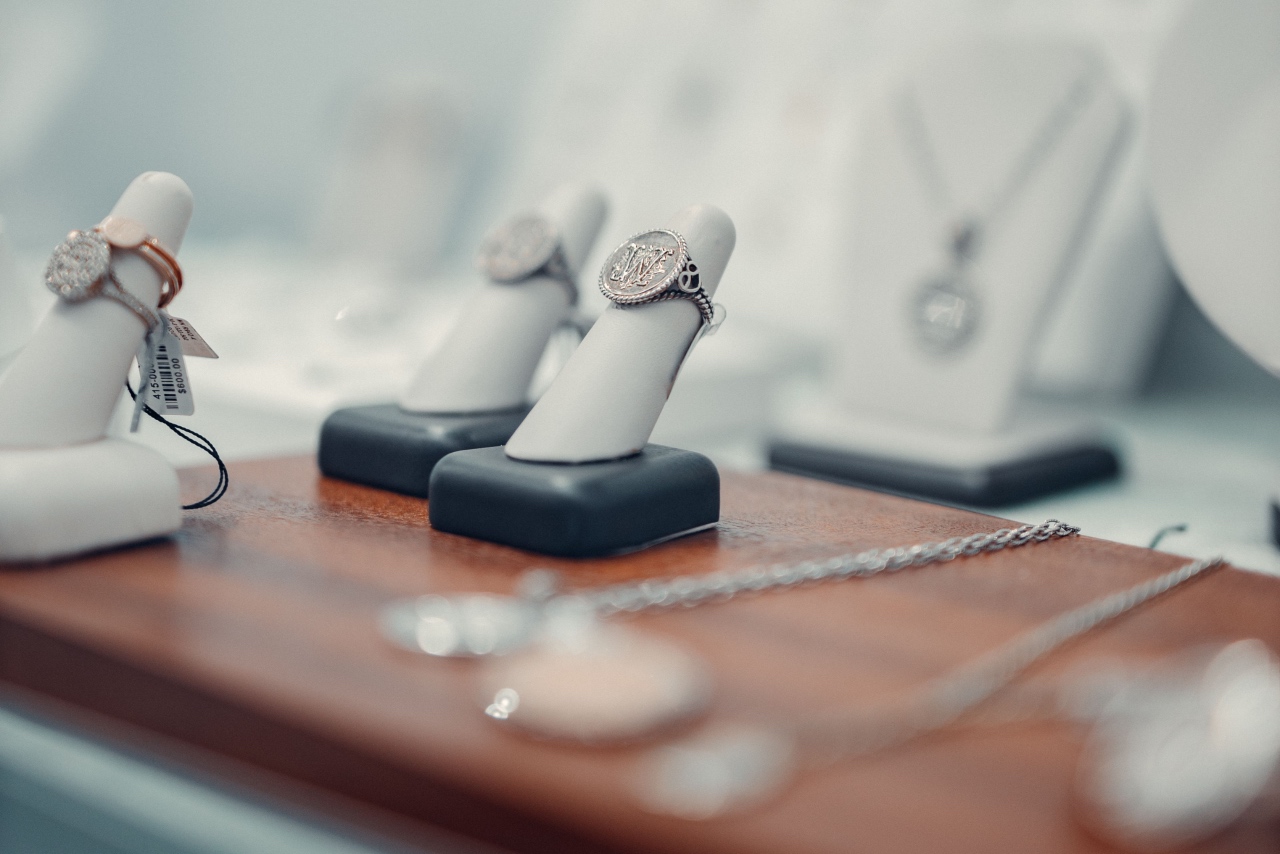 A close-up of a jewellery showcase displaying gold rings and pendants.